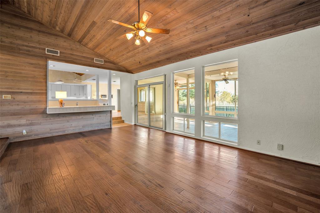 16753 Rolling Hills Lane Forney, TX 75126 - Photo 9 of 32 an empty room with wooden floor and windows