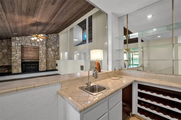 a kitchen with a sink and a refrigerator