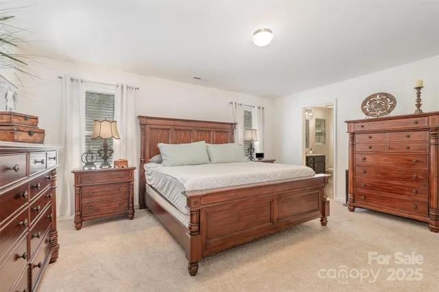 a bedroom with a bed and a tv