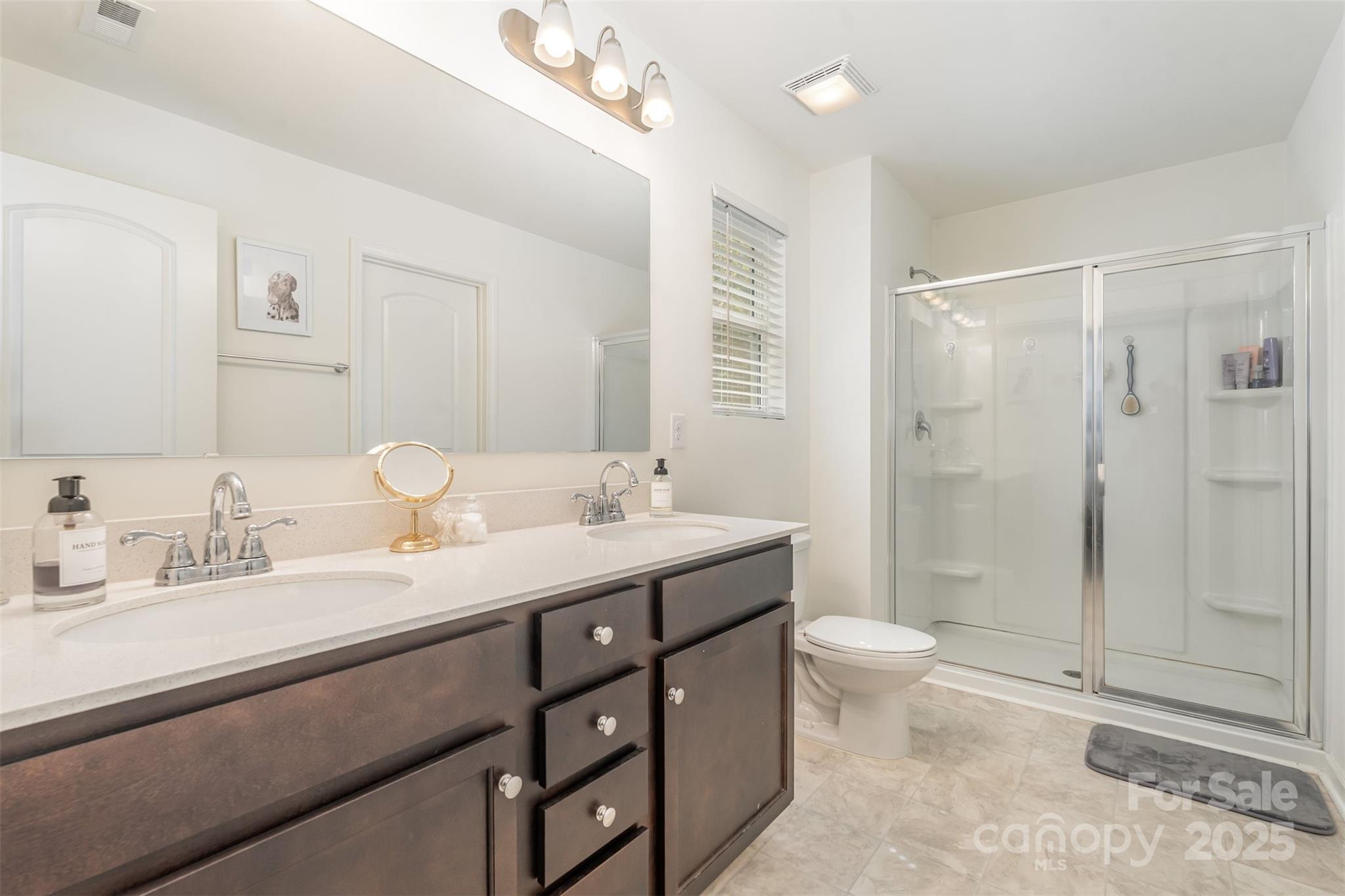 204 Shay Xing Road Salisbury, NC 28146 - Photo 13 of 22 a bathroom with a sink a toilet and shower