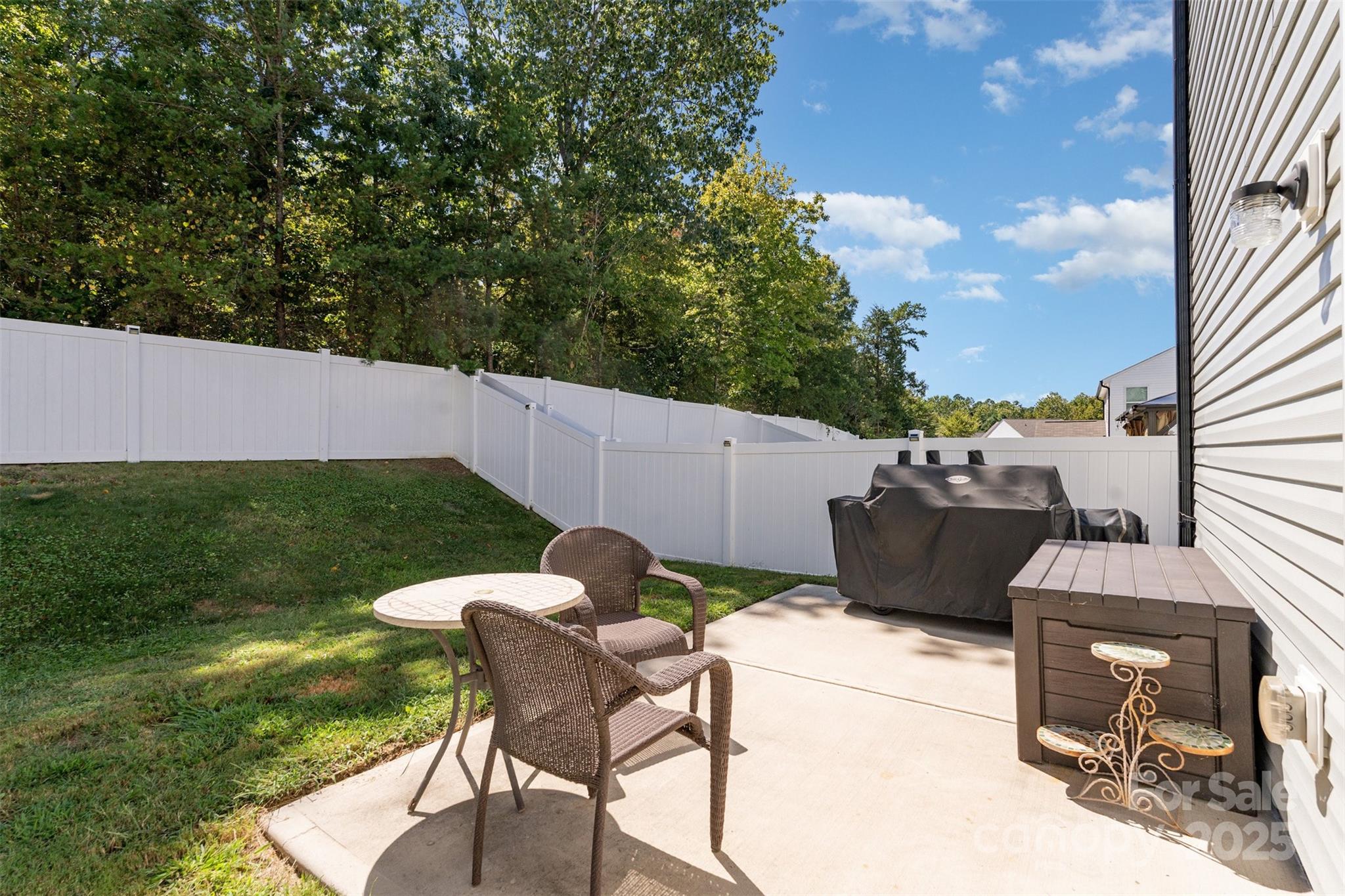 204 Shay Xing Road Salisbury, NC 28146 - Photo 18 of 22 a backyard of a house with table and chairs