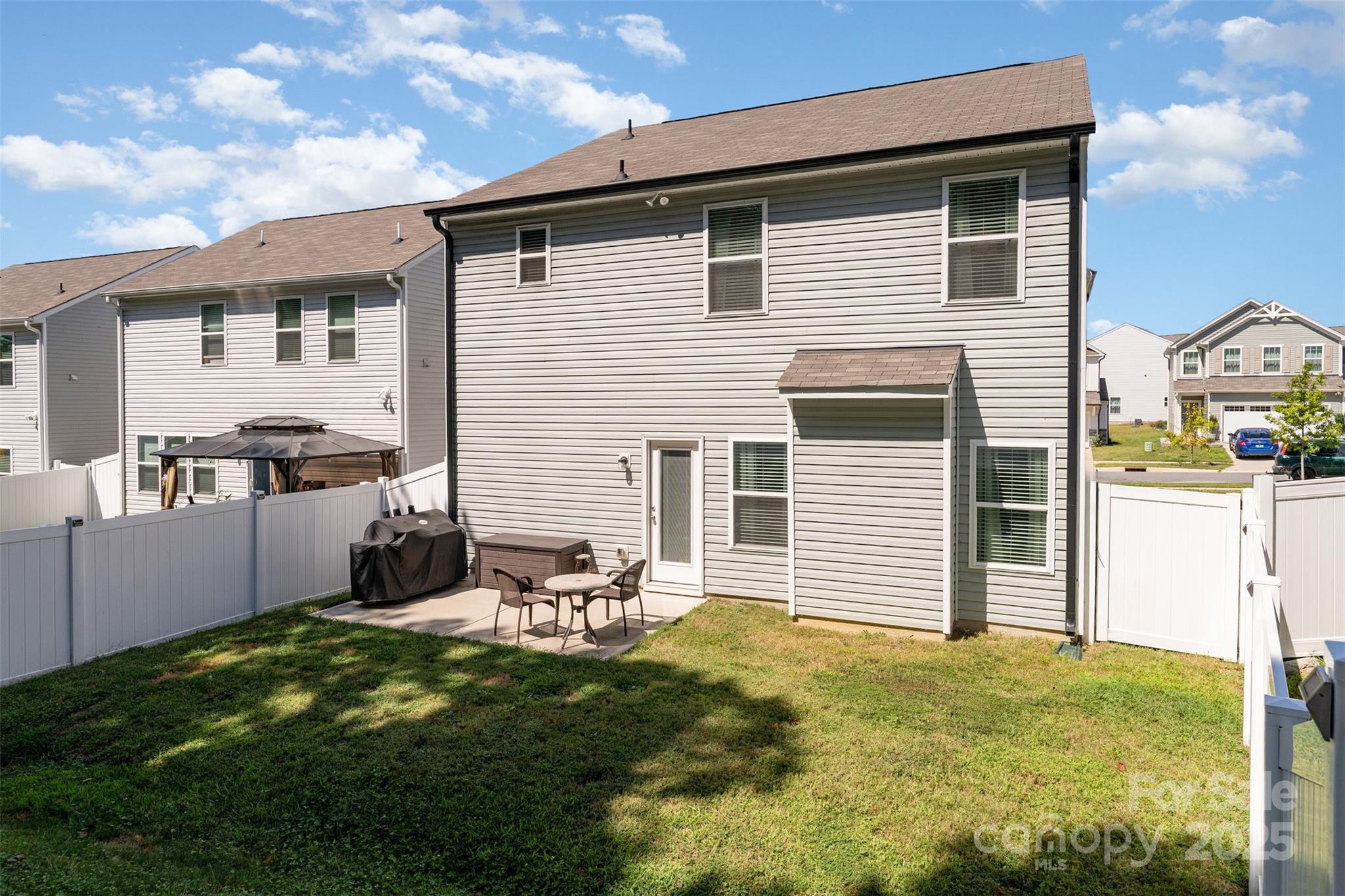 204 Shay Xing Road Salisbury, NC 28146 - Photo 20 of 22 a backyard of a house with table and chairs