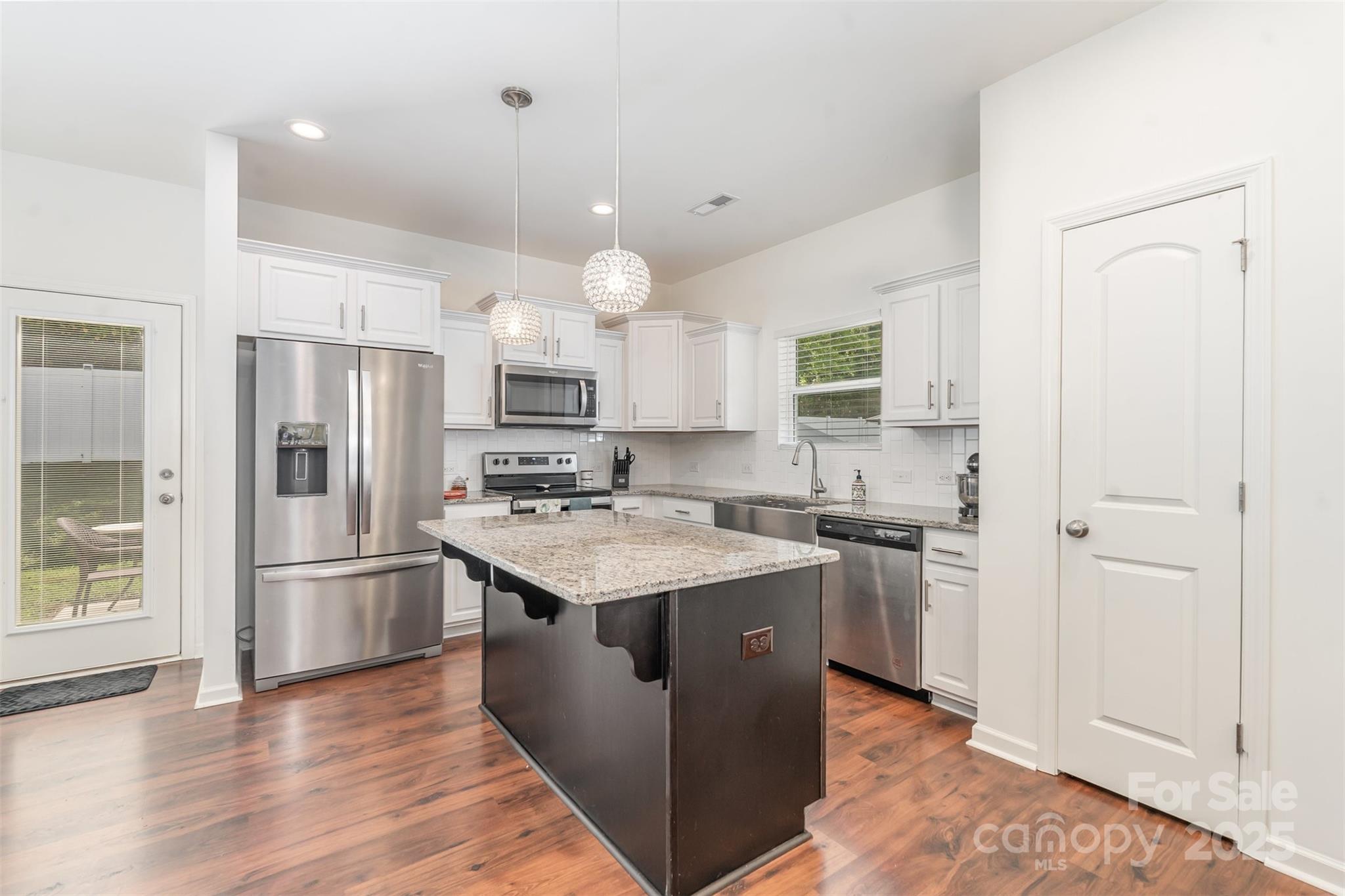 204 Shay Xing Road Salisbury, NC 28146 - Photo 4 of 22 a kitchen with stainless steel appliances granite countertop a refrigerator stove and sink