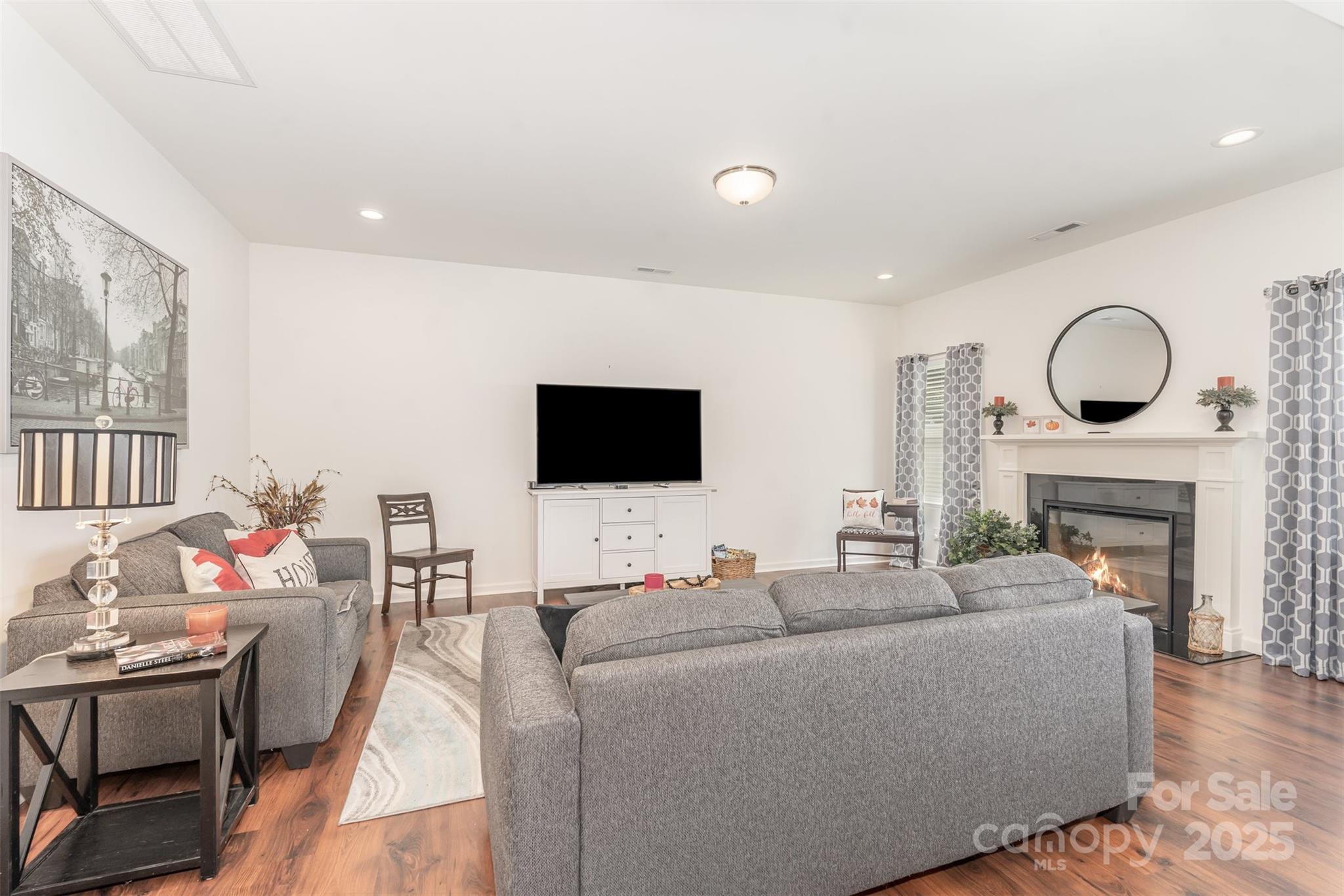 204 Shay Xing Road Salisbury, NC 28146 - Photo 8 of 22 a living room with furniture a fireplace and a flat screen tv