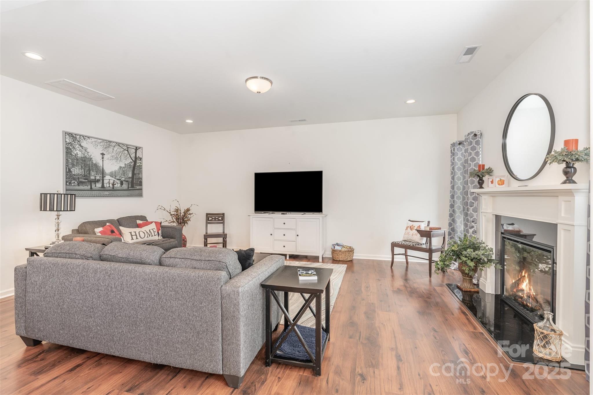 204 Shay Xing Road Salisbury, NC 28146 - Photo 9 of 22 a living room with furniture a fireplace and a flat screen tv
