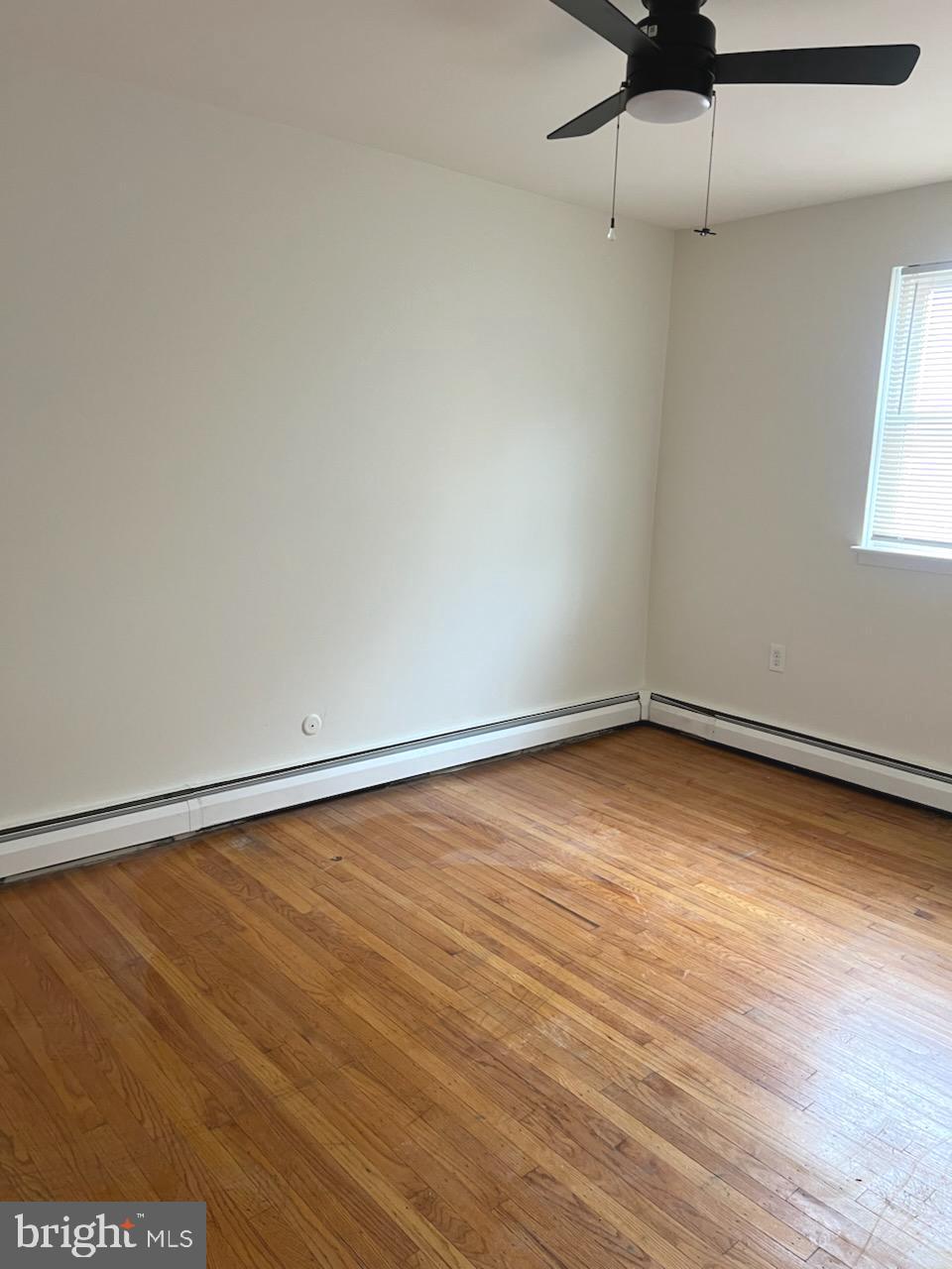 362 Ripka Street Philadelphia, PA 19128 - Photo 7 of 18 a view of a room with wooden floor and fan