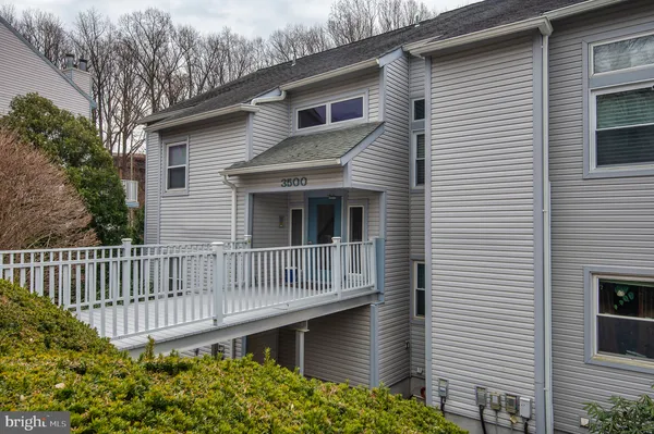 a front view of a house with a deck