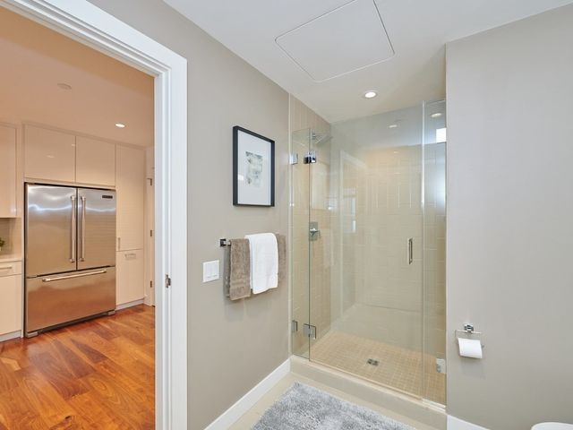 a bathroom with a shower and a sink