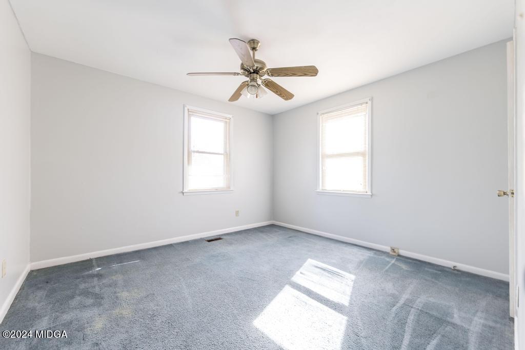 4632 Brookhaven Road Macon, GA 31206 - Photo 17 of 20 an empty room with windows and fan