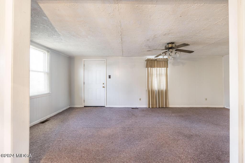 4632 Brookhaven Road Macon, GA 31206 - Photo 8 of 20 an empty room with windows