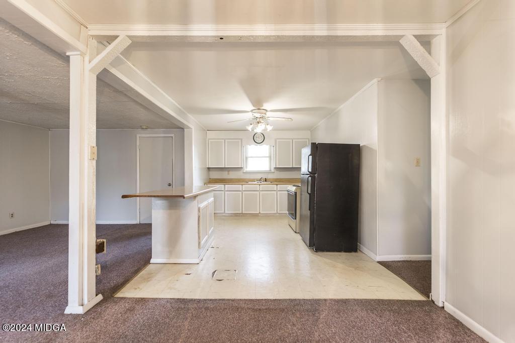 4632 Brookhaven Road Macon, GA 31206 - Photo 9 of 20 a view of a kitchen with refrigerator and wooden floor