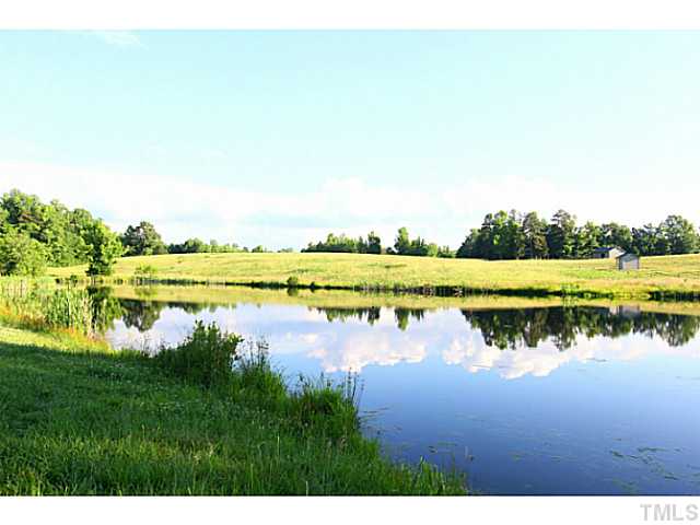 803 Fieldstone Road Roxboro, NC 27574 - Photo 2 of 25 a view of a lake with houses in background