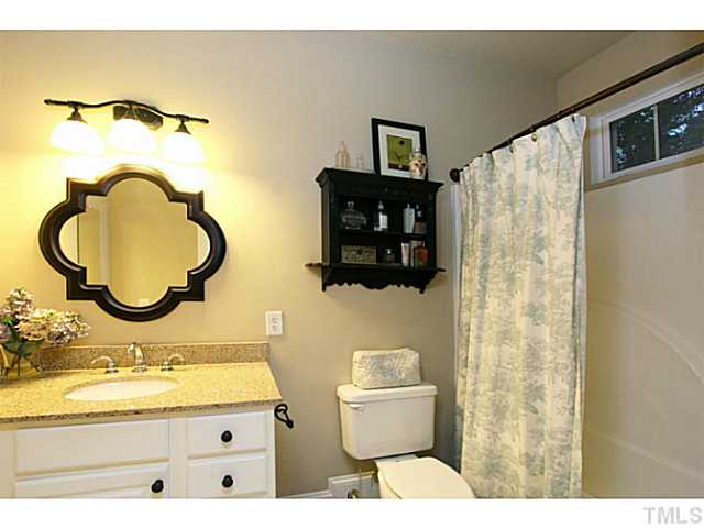 803 Fieldstone Road Roxboro, NC 27574 - Photo 8 of 25 a bathroom with a sink mirror vanity and toilet