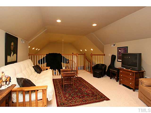 803 Fieldstone Road Roxboro, NC 27574 - Photo 9 of 25 a living room with furniture and a flat screen tv