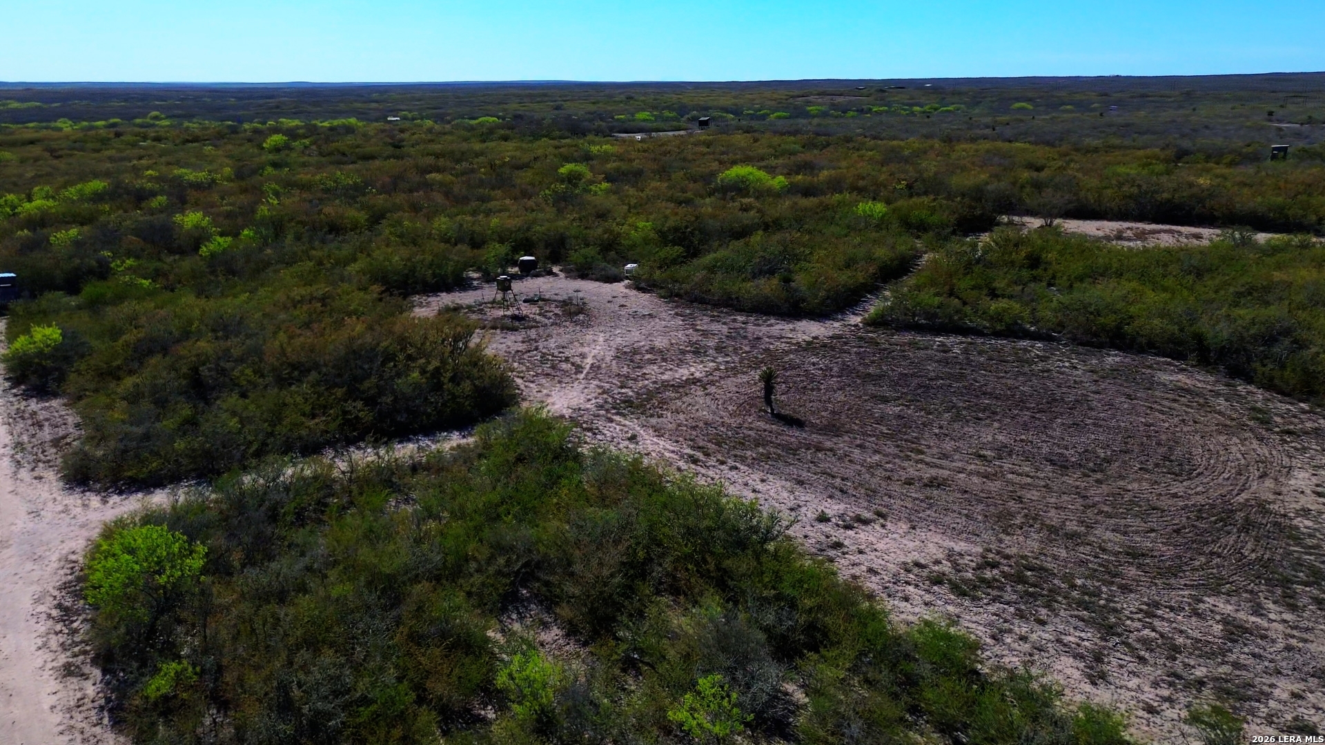 128 Salyer George George West, TX 78022 - Photo 11 of 18 a view of a dry yard with lots of green space