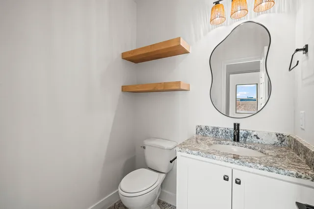 a bathroom with a toilet and a sink