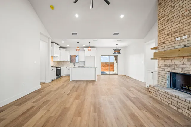 a view of a kitchen with furniture and a fireplace