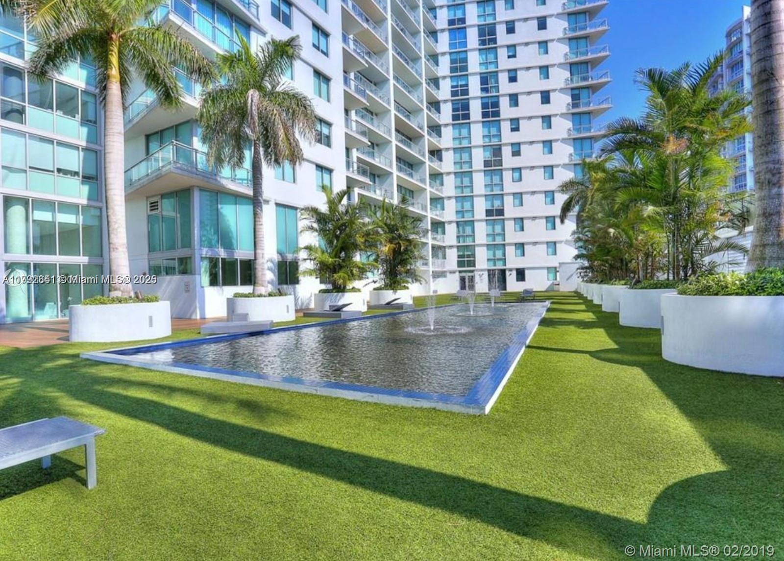 92 Southwest 3rd Street, Unit 3903 Miami, FL 33130 - Photo 20 of 25 a view of a swimming pool with a patio