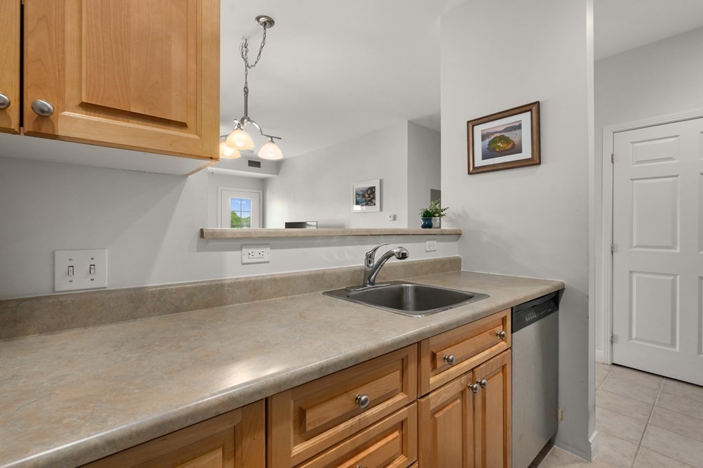 8 Walnut Street, Unit 406 Peabody, MA 01960 - Photo 13 of 31 a kitchen with a sink and cabinets