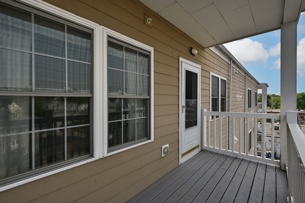 8 Walnut Street, Unit 406 Peabody, MA 01960 - Photo 29 of 31 a view of house with deck and windows