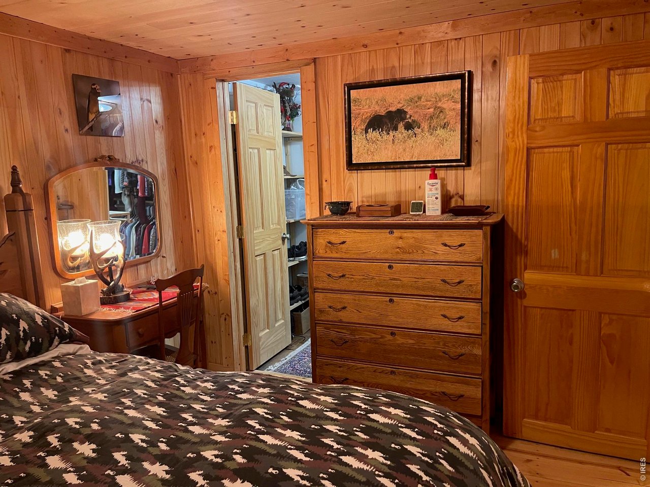 124 Ski Road Allenspark, CO 80510 - Photo 23 of 29 a view of a bedroom with workspace
