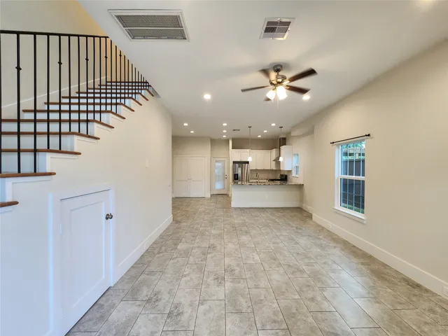 a view of entryway and kitchen