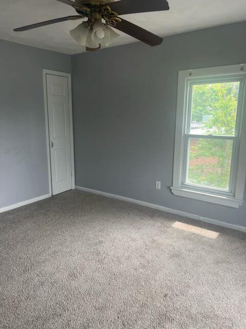 25 Ridge Street Middletown, NY 10940 - Photo 4 of 10 Empty room with ceiling fan and carpet