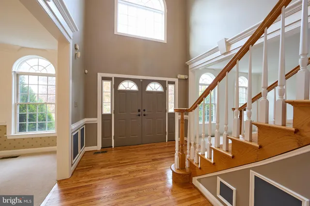 an aerial view of residential house with pool and garden