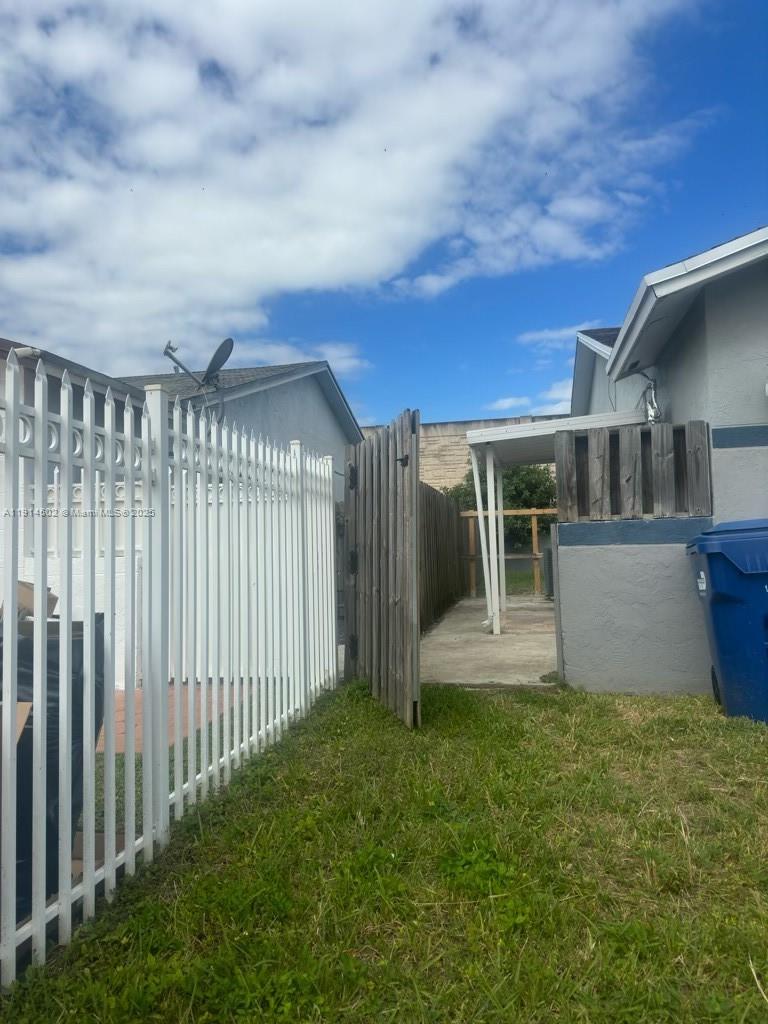 12539 Southwest 259th Street, Unit B Homestead, FL 33032 - Photo 11 of 11 a view of a house with a backyard