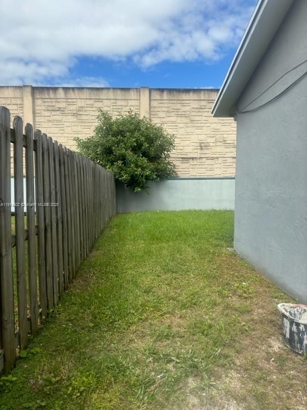 12539 Southwest 259th Street, Unit B Homestead, FL 33032 - Photo 10 of 11 a view of a garden