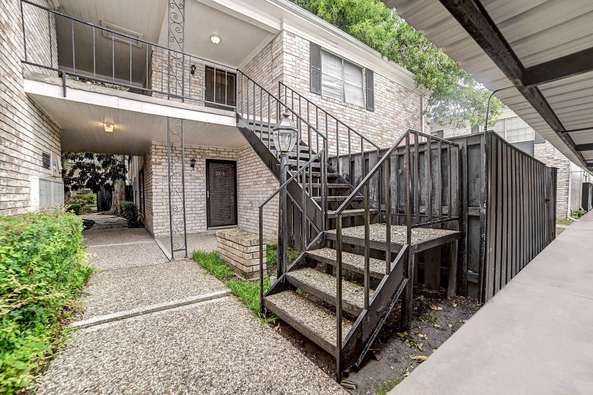 a view of a house with backyard and deck