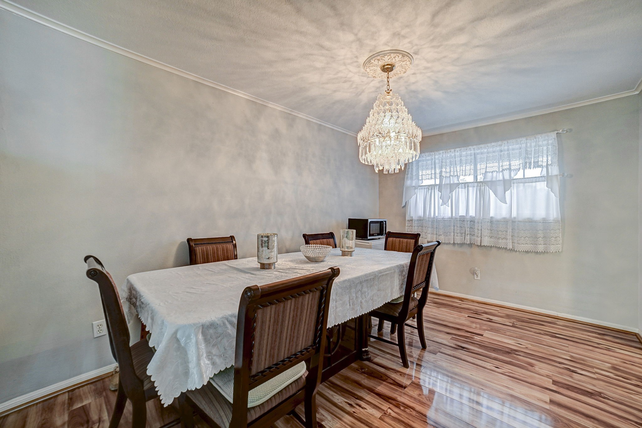 7900 Westheimer Road, Unit 202 Houston, TX 77063 - Photo 11 of 27 a dining room with a wooden table and chairs