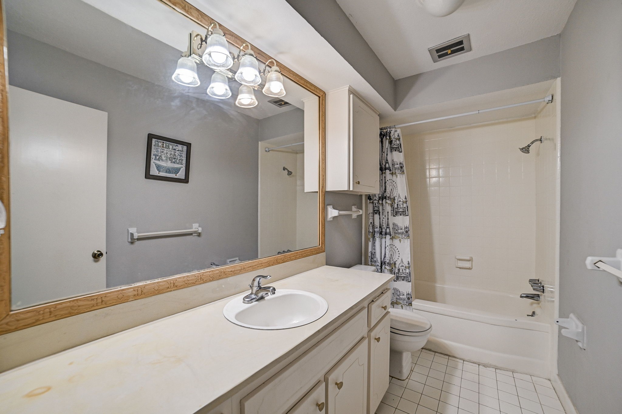 7900 Westheimer Road, Unit 202 Houston, TX 77063 - Photo 17 of 27 a bathroom with a sink a toilet and shower