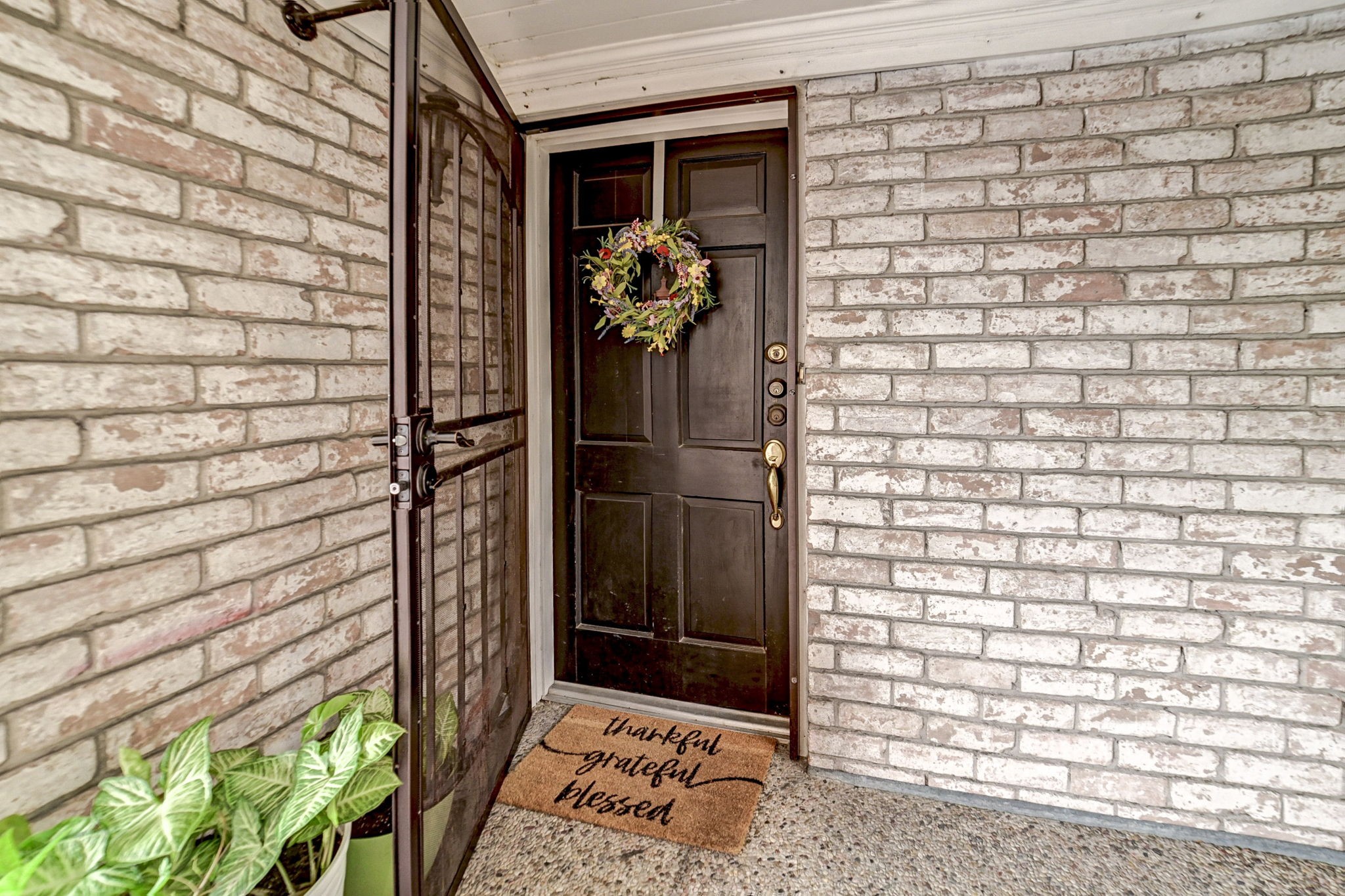 7900 Westheimer Road, Unit 202 Houston, TX 77063 - Photo 4 of 27 a view of a glass door and a window