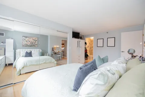 a bedroom with a bed and a couch