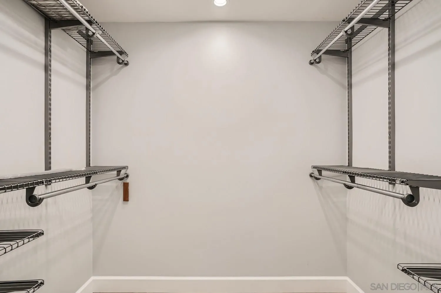 20555 Bee Valley Road Jamul, CA 91935 - Photo 18 of 33 a view of a room with rack on the wall
