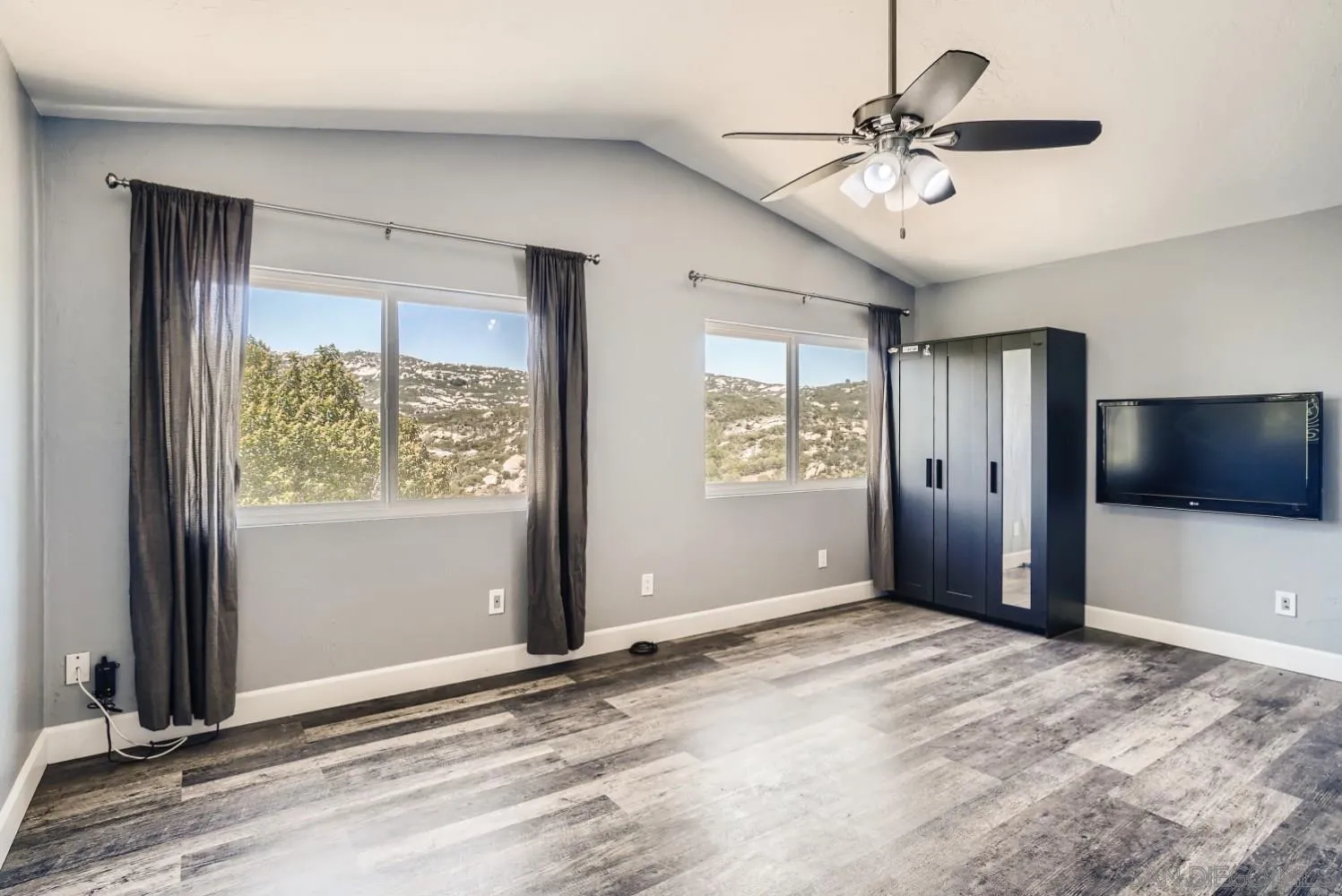 20555 Bee Valley Road Jamul, CA 91935 - Photo 19 of 33 a view of an empty room with a window