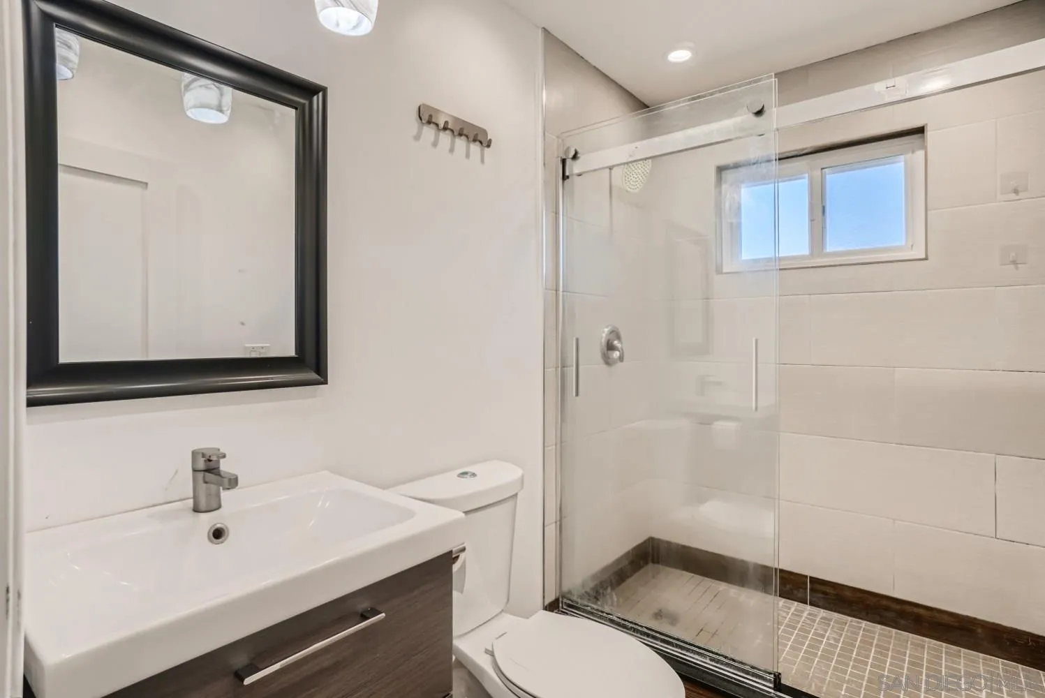 20555 Bee Valley Road Jamul, CA 91935 - Photo 22 of 33 a bathroom with a sink a toilet and shower