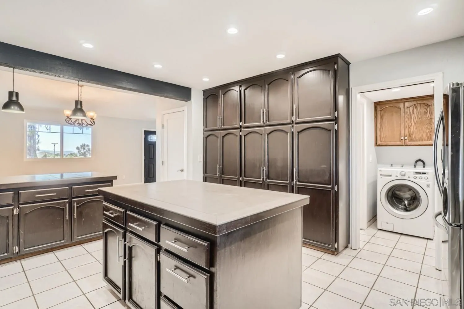 20555 Bee Valley Road Jamul, CA 91935 - Photo 8 of 33 a kitchen with stainless steel appliances granite countertop a sink and a refrigerator
