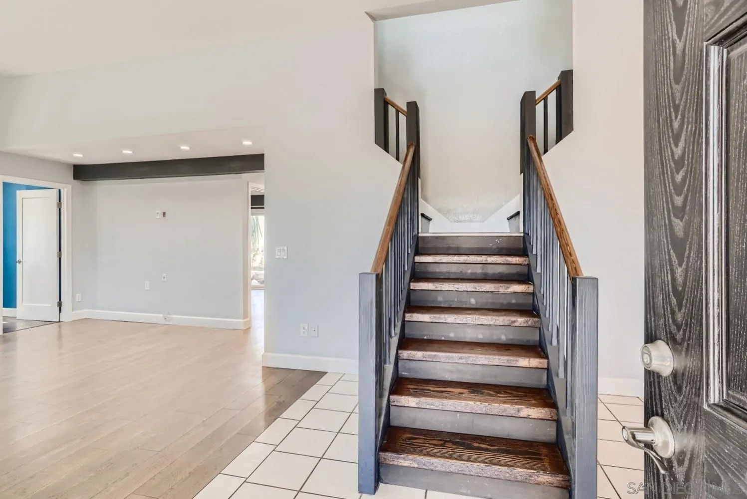 20555 Bee Valley Road Jamul, CA 91935 - Photo 9 of 33 a view of an entryway with wooden floor and stairs