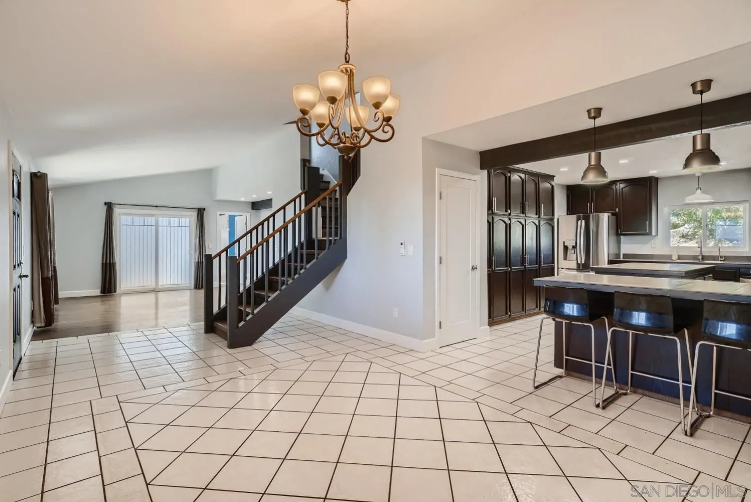 20555 Bee Valley Road Jamul, CA 91935 - Photo 10 of 33 a view of entryway with kitchen island dining table and chairs