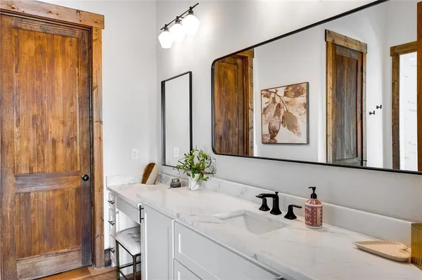 a bathroom with a sink and a mirror