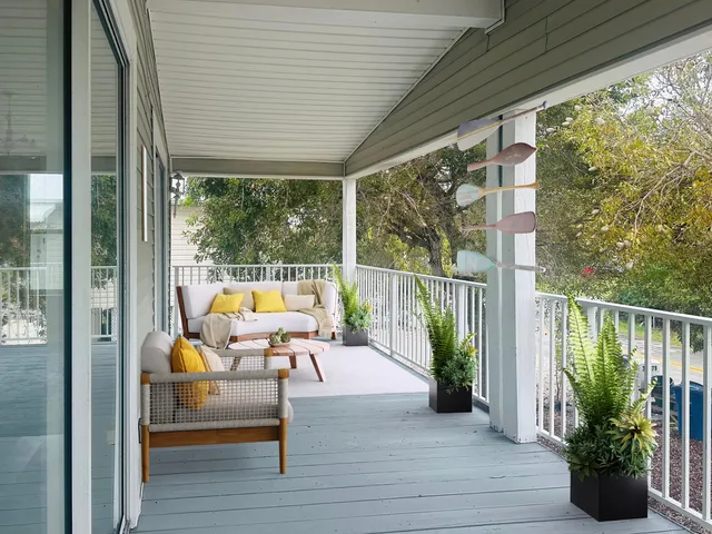 a kitchen with granite countertop stainless steel appliances a sink window and cabinets