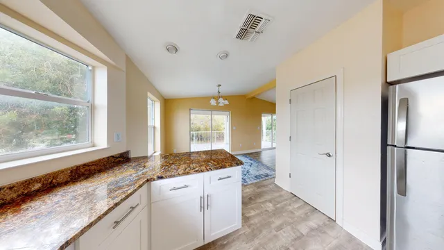 a living room with fish tank and a bookshelf