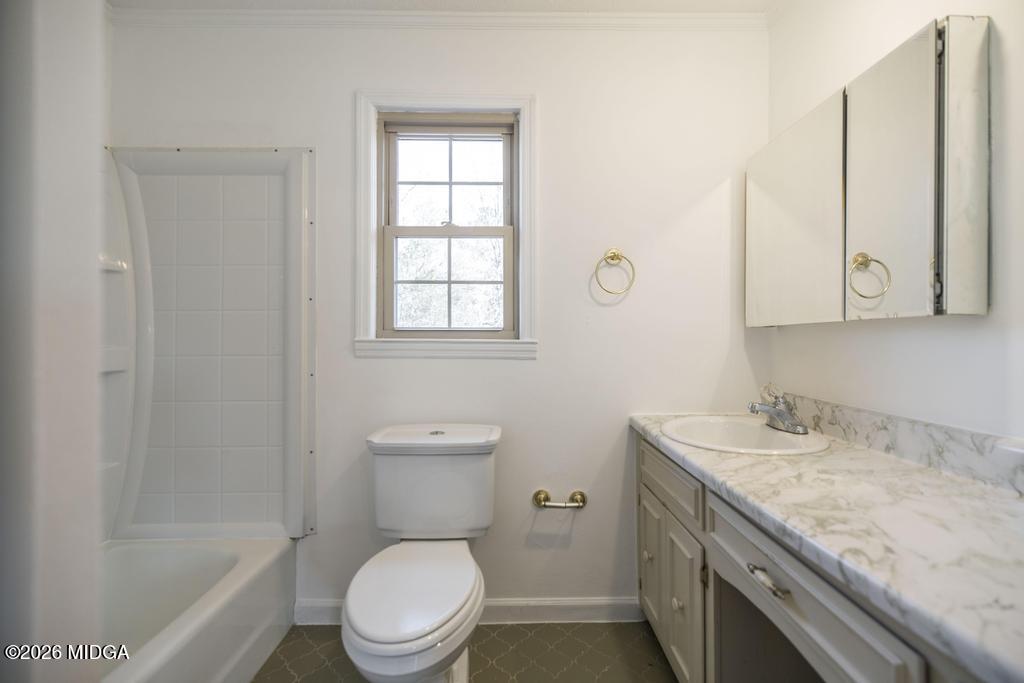 5624 Rogers Road Lizella, GA 31052 - Photo 23 of 39 a bathroom with a granite countertop toilet sink and mirror