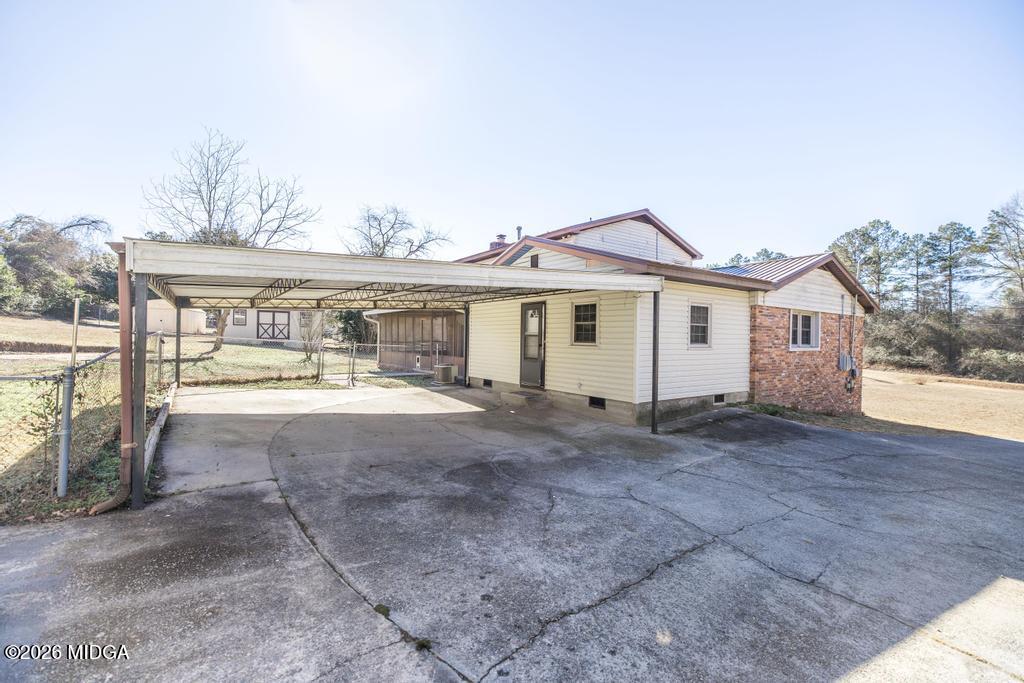 5624 Rogers Road Lizella, GA 31052 - Photo 34 of 39 a view of house with outdoor space and sitting area