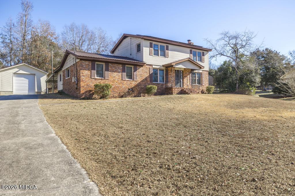 5624 Rogers Road Lizella, GA 31052 - Photo 5 of 39 front view of a house with a yard