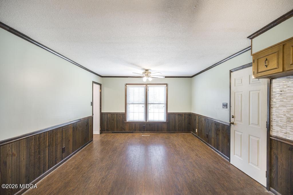 5624 Rogers Road Lizella, GA 31052 - Photo 10 of 39 a view of empty room with wooden floor and fan