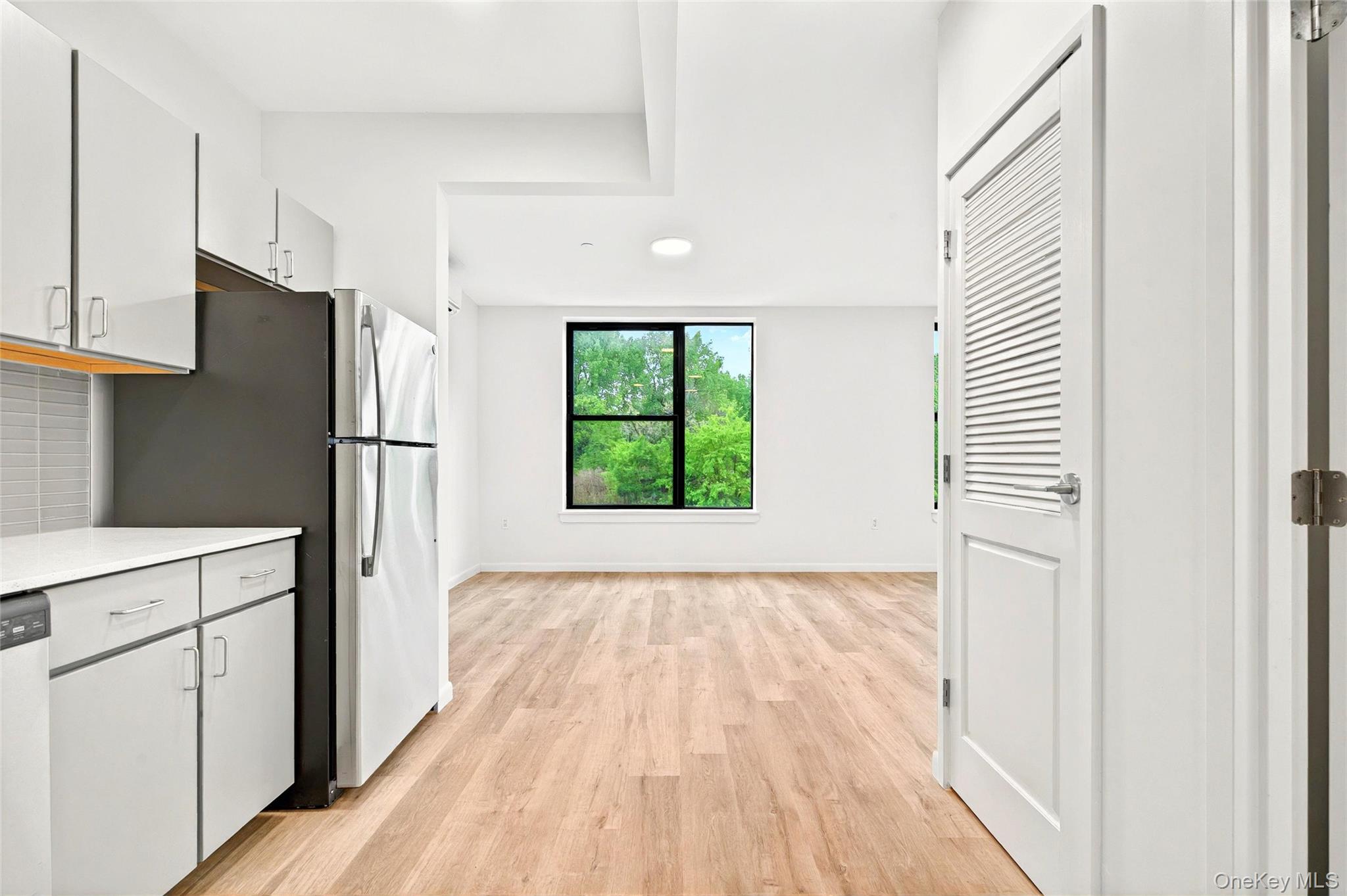 355 Bronx River Avenue, Unit 3B Bronx, NY 10473 - Photo 14 of 24 a view of a kitchen with a white cabinet and a refrigerator