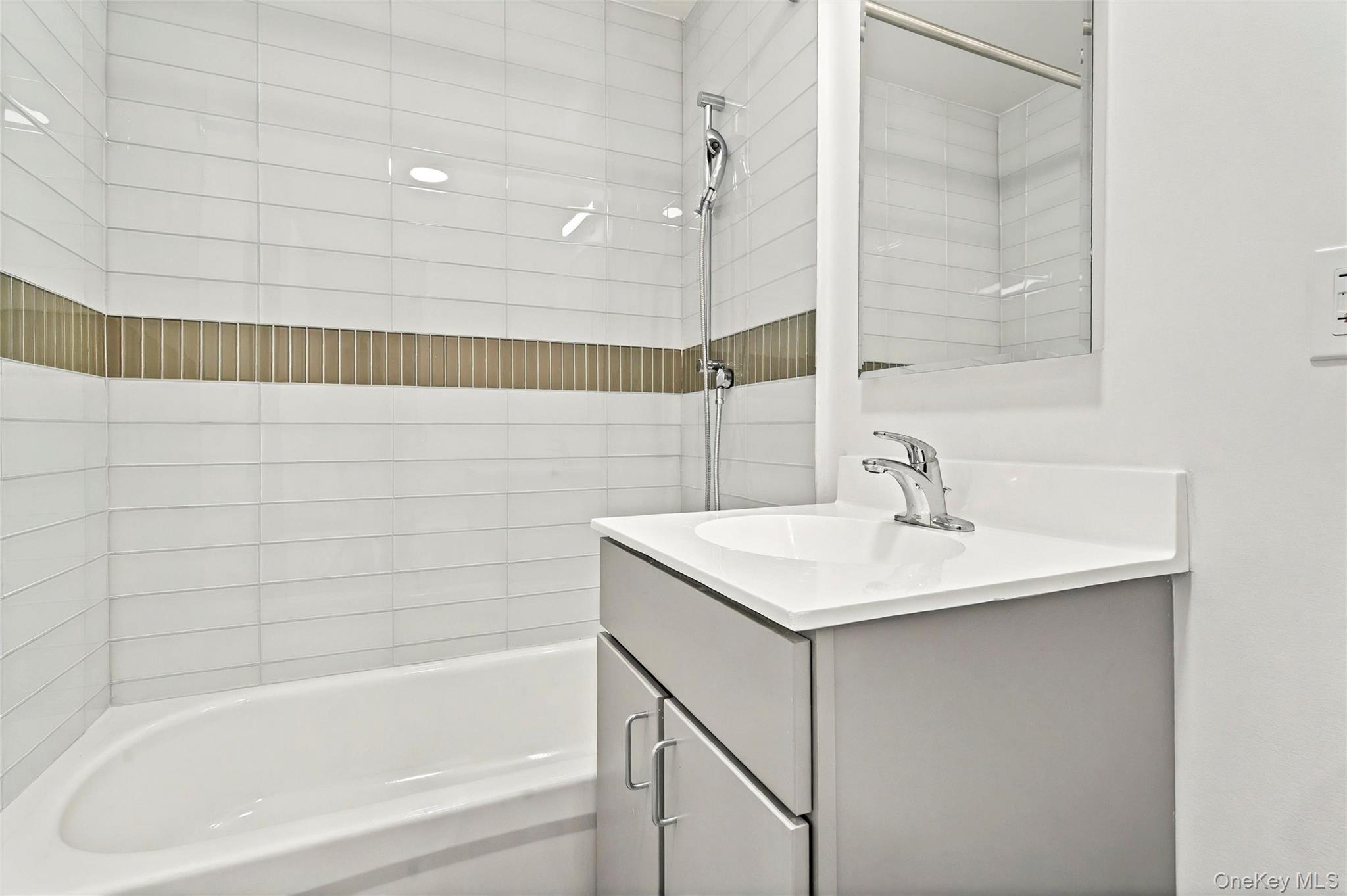 355 Bronx River Avenue, Unit 3B Bronx, NY 10473 - Photo 20 of 24 a bathroom with a sink and a bathtub